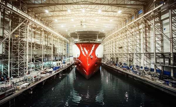 A ship being build in a shipbuilding facility