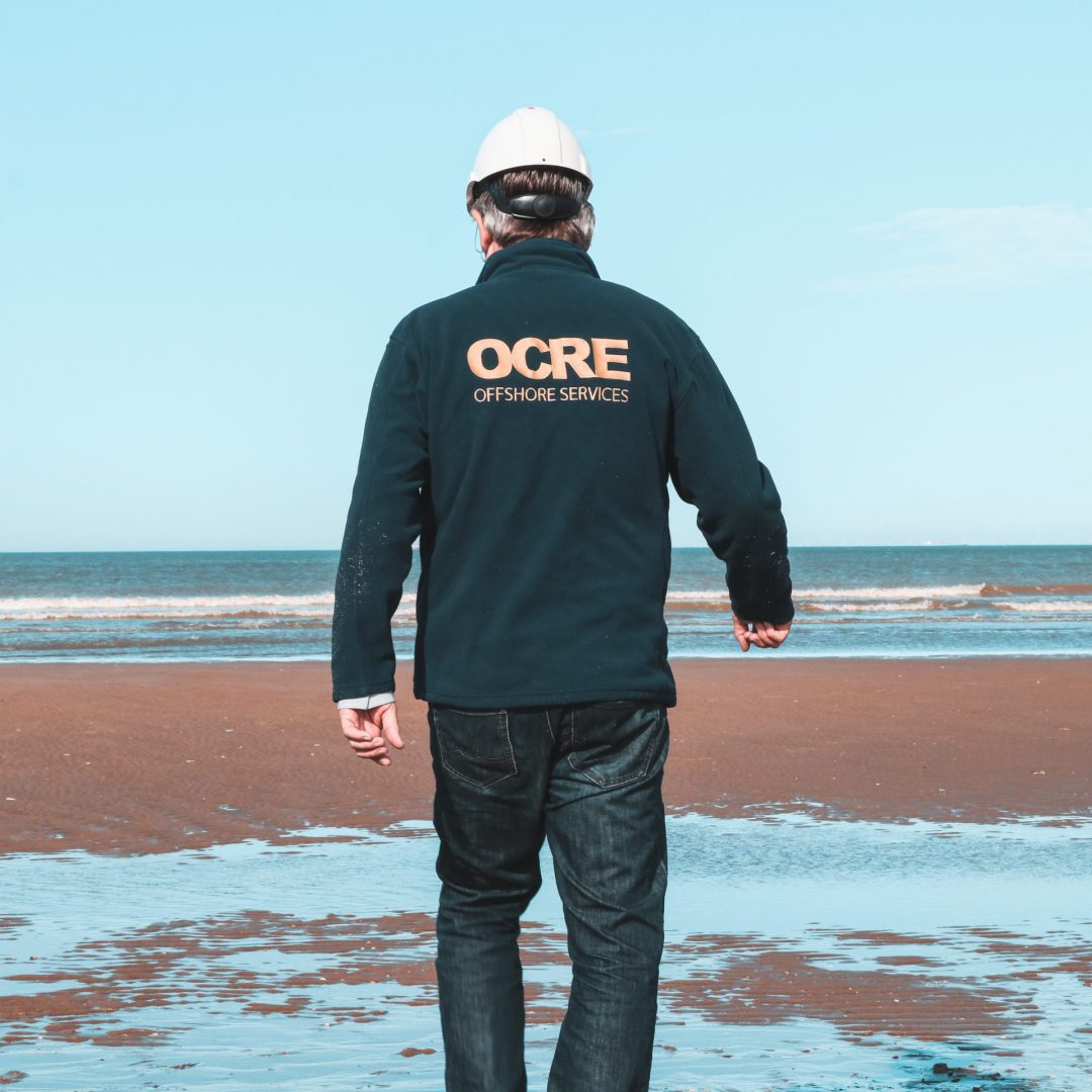 Man wearing a OCRE branded vest